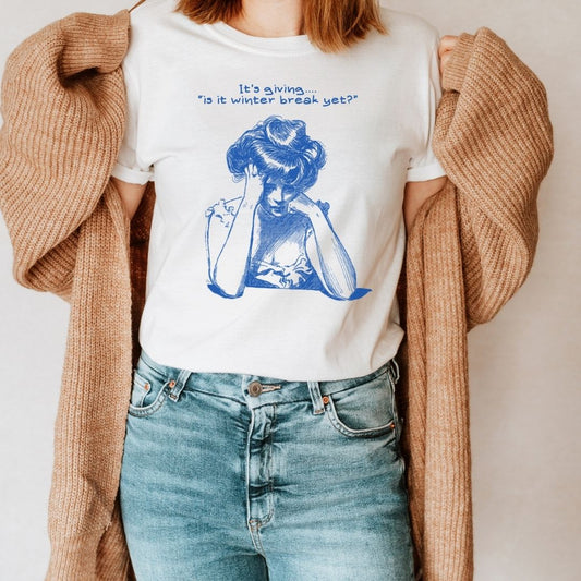 "It's Giving... Is it Winter Break Yet?" Teacher T-shirt - Teacher Care Crate - T-Shirt