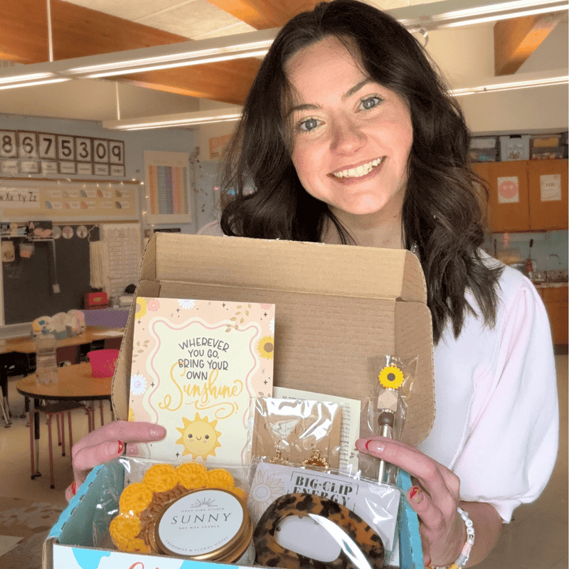 A teacher holding her Teacher Care Crate