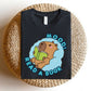 "MOOD: Read A Book" Capybara Teacher T-shirt - Teacher Care Crate-T-Shirt