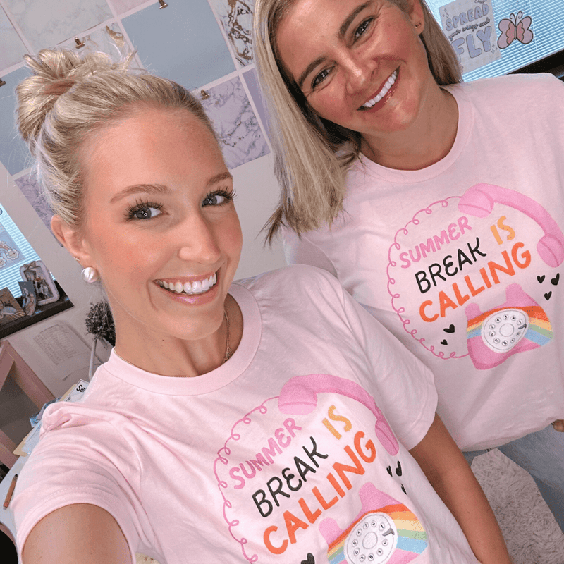 Two teachers wearing Tee Club shirts