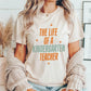 "The Life of a Kindergarten Teacher" Swiftie Teacher T-shirt - Teacher Care Crate - T-Shirt